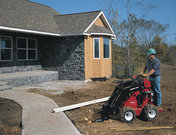 Toro Dingo 323 with bore head drive attachment