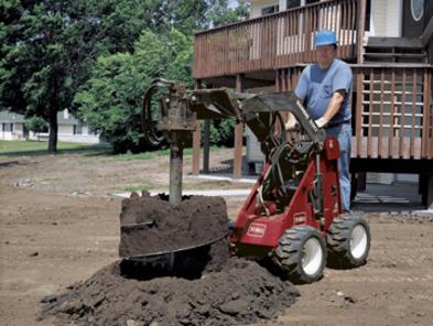 Toro Dingo TX 220 with high torque auger attachment