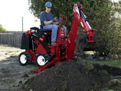 Toro Dingo TX 323 with backhoe attachment