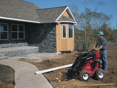 Toro Dingo 323 with bore head drive attachment