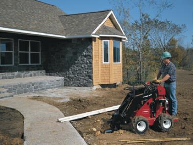 Toro Dingo 323 with bore head drive attachment